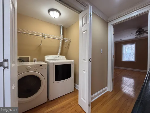 a view of a hallway with washer and dryer