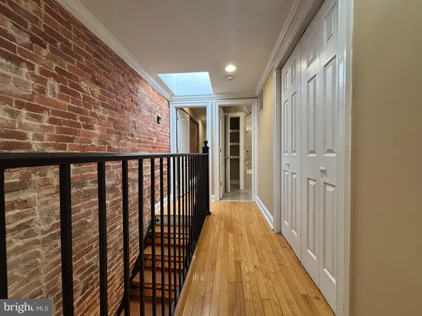 a view of a balcony with wooden floor