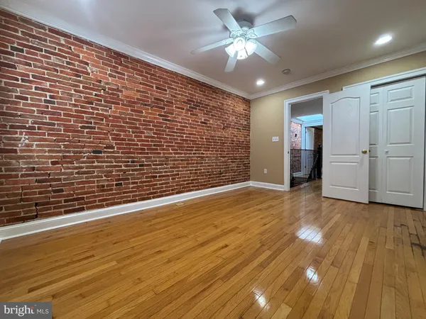 a view of an empty room and wooden floor
