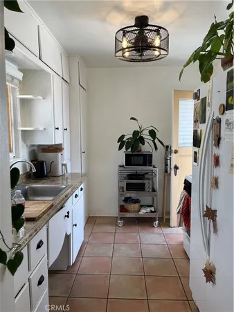 a kitchen with stainless steel appliances a stove and cabinets