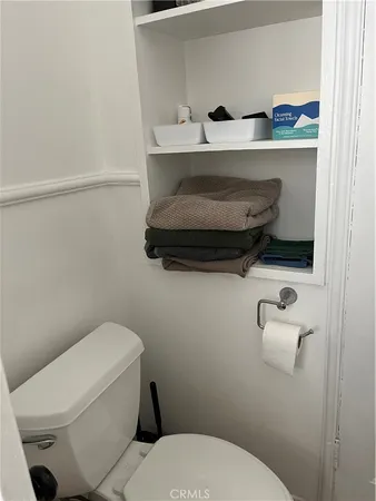 a bathroom with a toilet and a sink