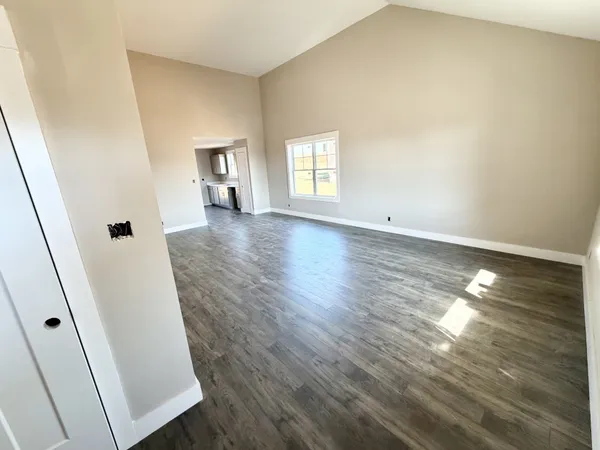 a bathroom with a granite countertop sink a mirror and a bathtub