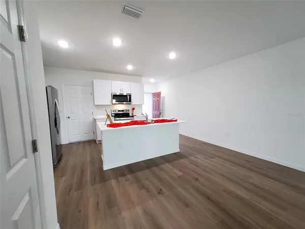 a view of storage and utility room with washer and dryer