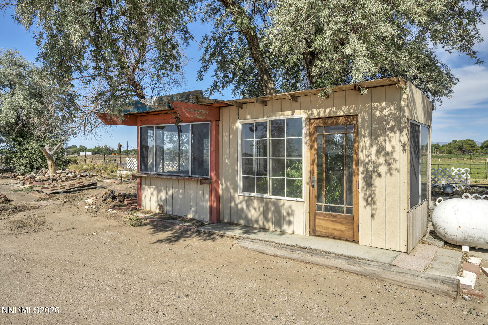 5250 Stillwater Road Fallon, NV 89406 - Photo 32 of 53 a front view of a house with a yard
