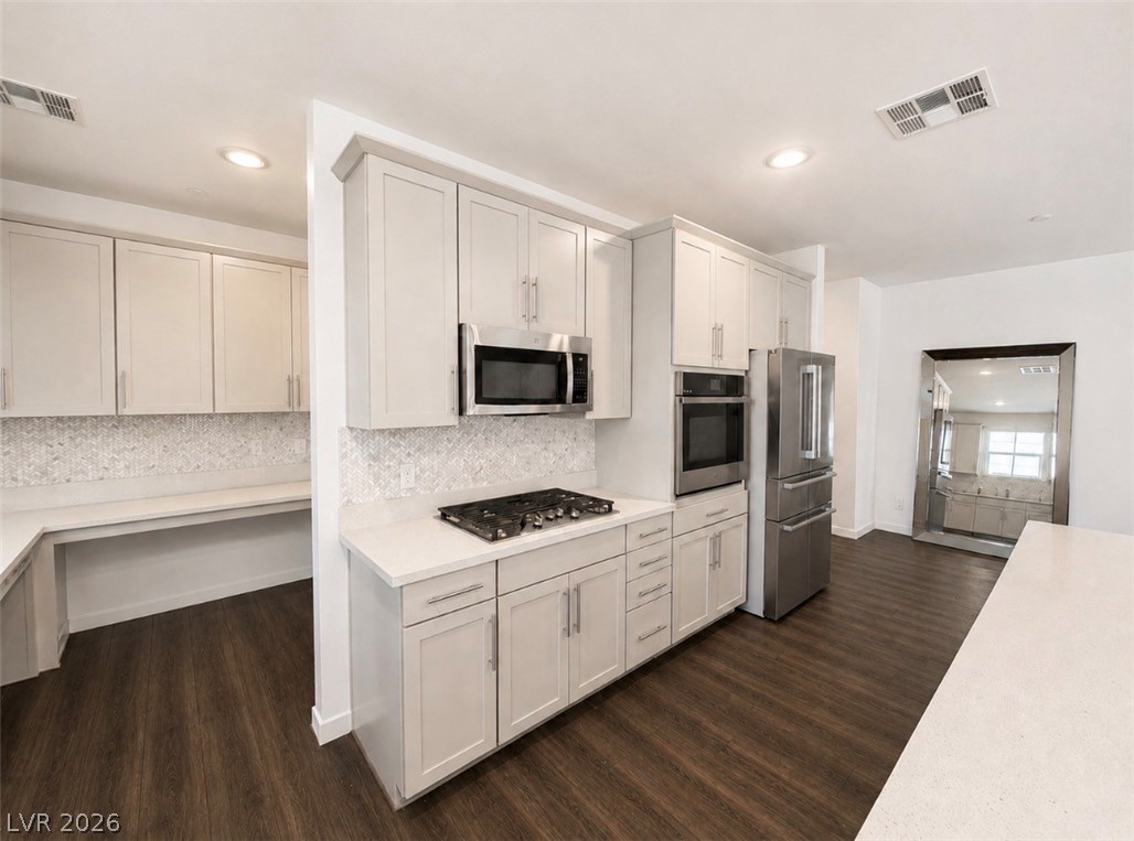 2555 Hampton Road, Unit 4205 Henderson, NV 89052 - Photo 8 of 52 This modern kitchen features sleek countertops and appliances, ideal for culinary enthusiasts.