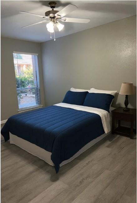 12830 Midway Road, Unit 1129 Dallas, TX 75244 - Photo 13 of 18 a bedroom with a bed and window