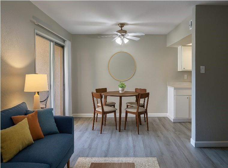 12830 Midway Road, Unit 1129 Dallas, TX 75244 - Photo 3 of 18 a view of a livingroom with furniture and wooden floor