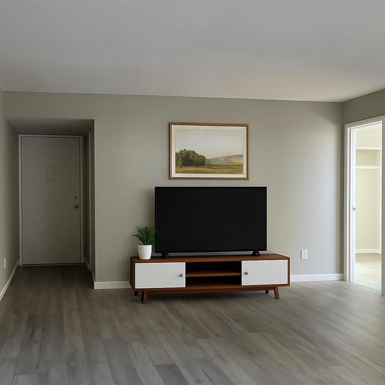 12830 Midway Road, Unit 1129 Dallas, TX 75244 - Photo 4 of 18 a living room with furniture and a flat screen tv