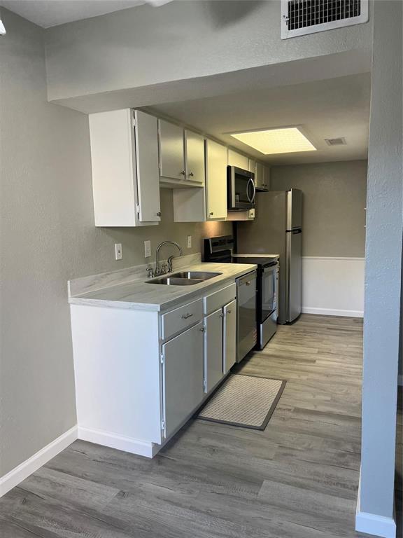 12830 Midway Road, Unit 1129 Dallas, TX 75244 - Photo 5 of 18 a kitchen with a sink cabinets and window