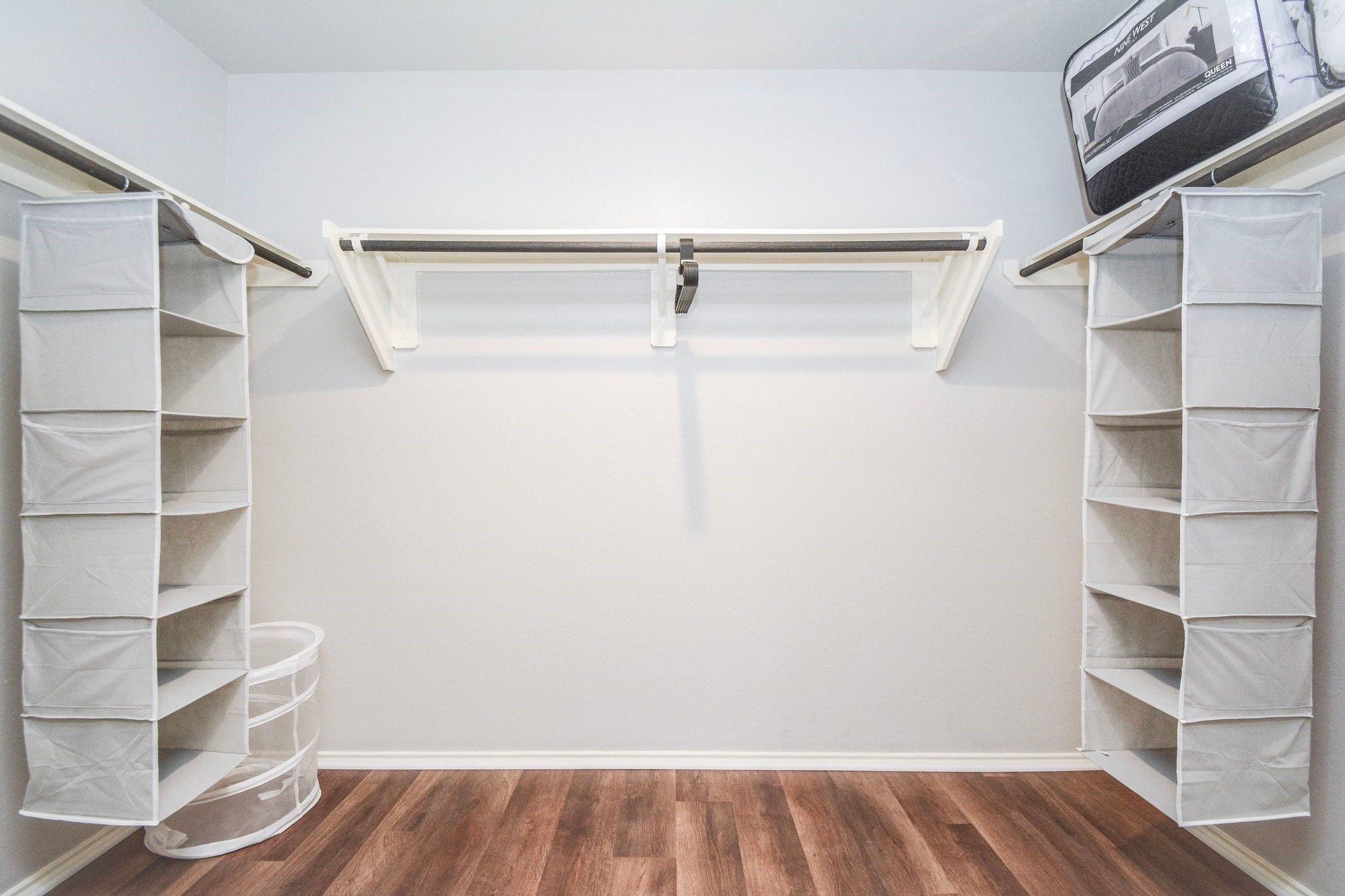 23510 Harrow Fld Lane Spring, TX 77373 - Photo 13 of 18 a view of walk in closet with empty racks