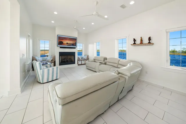 a spacious bathroom with a double vanity sink a mirror a bathtub and