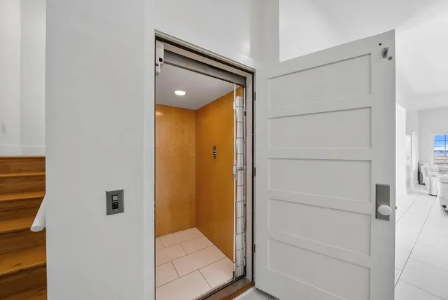 a bathroom with a shower and a sink