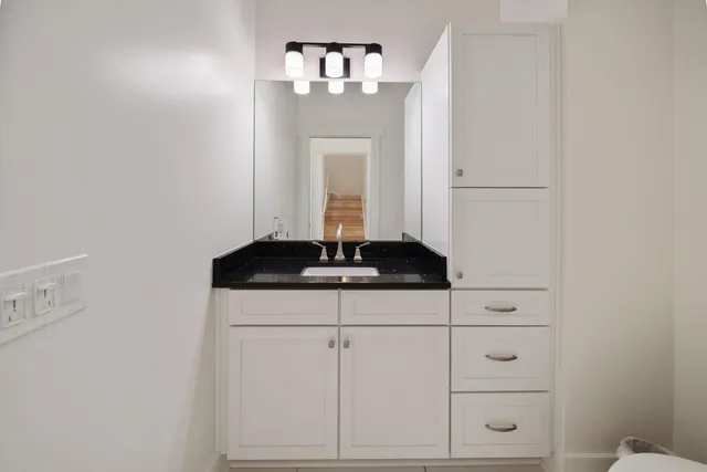 a kitchen with a sink and cabinets
