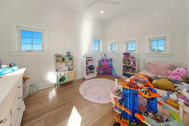 a view of a patio with couches table and chairs and potted plants