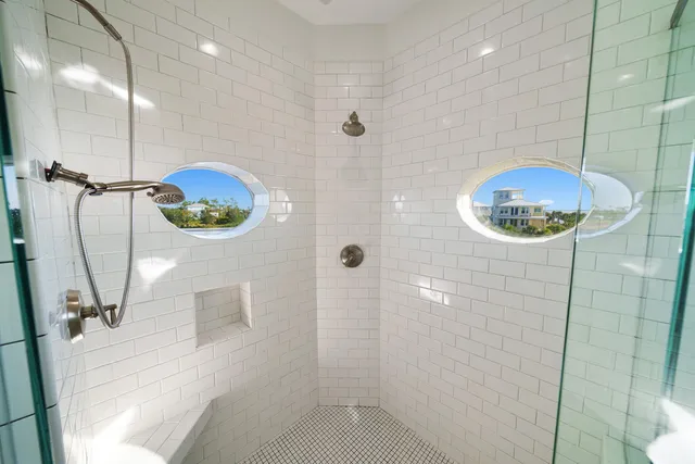a view of a roof deck with a chair and wooden floor