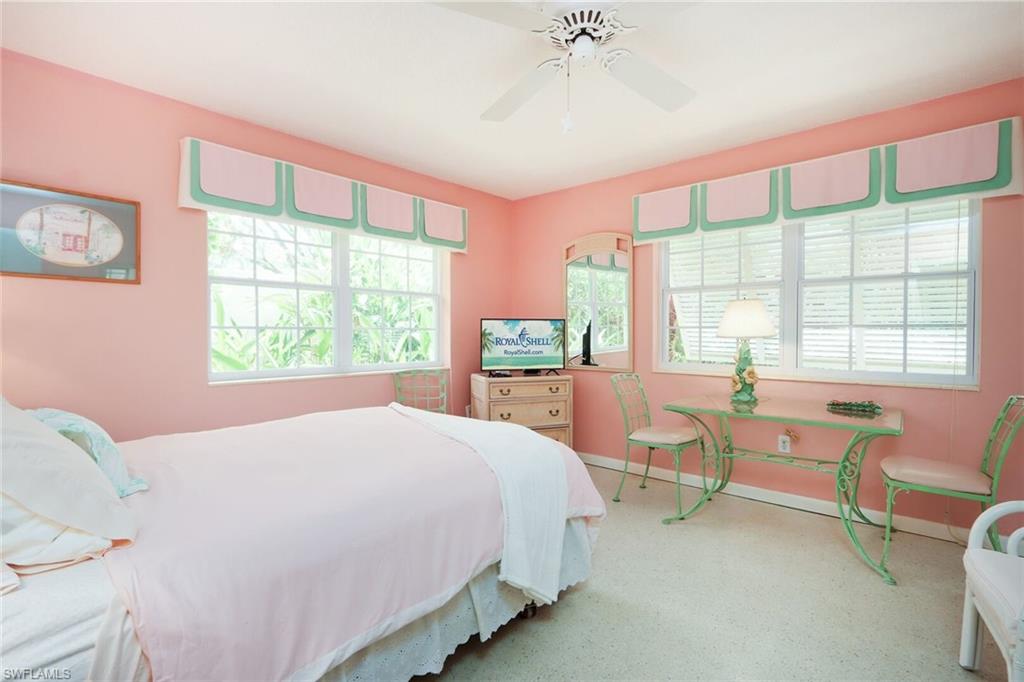 361 1st Avenue North Naples, FL 34102 - Photo 21 of 31 a bedroom with a bed and a view of chair
