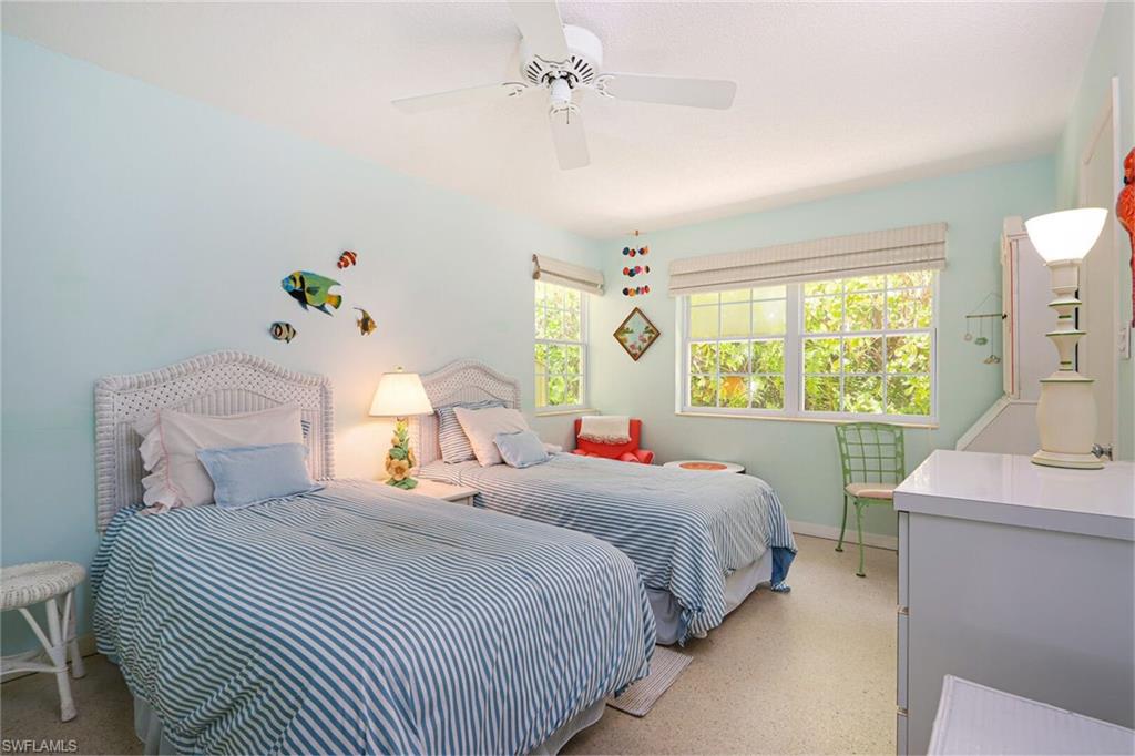 361 1st Avenue North Naples, FL 34102 - Photo 24 of 31 a bedroom with a bed and a window