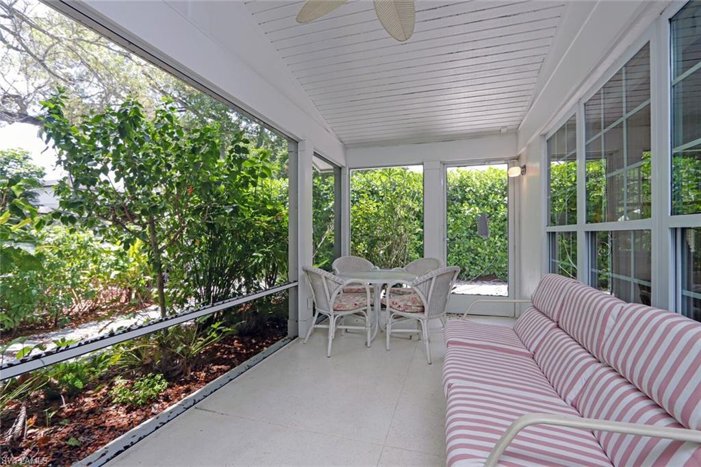361 1st Avenue North Naples, FL 34102 - Photo 29 of 31 a balcony with furniture and garden view