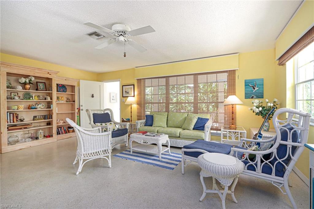 361 1st Avenue North Naples, FL 34102 - Photo 6 of 31 a living room with furniture and a large window