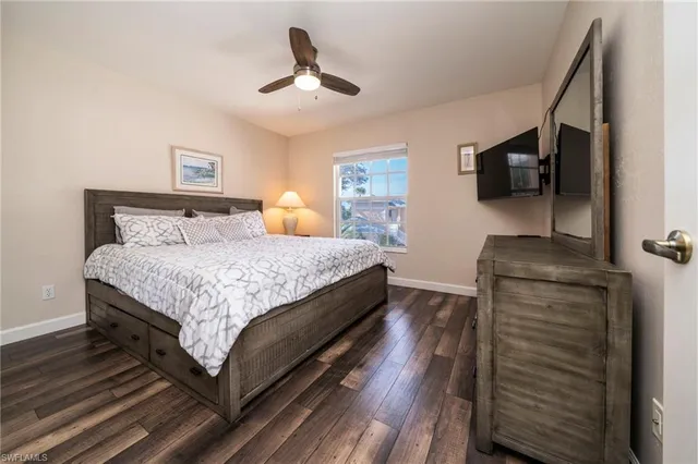 a bedroom with a bed and flat screen tv