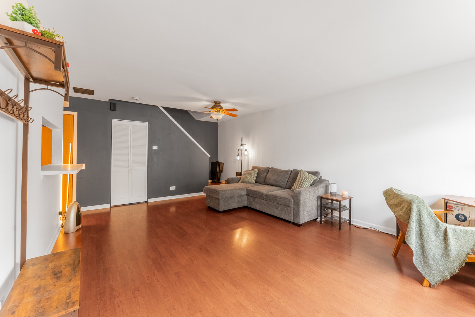 1584 Normantown Road Naperville, IL 60564 - Photo 6 of 36 a living room with furniture and a ceiling fan