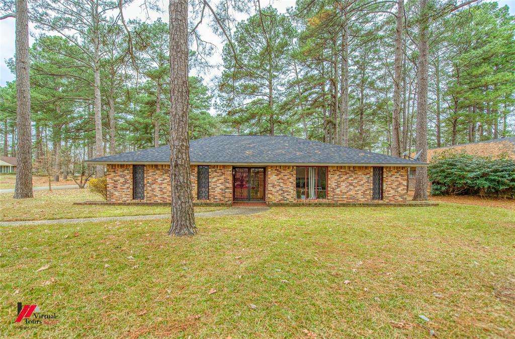 1404 North Acres Circle Springhill, LA 71075 - Photo 2 of 29 Single story home with brick siding, a front lawn, and a shingled roof