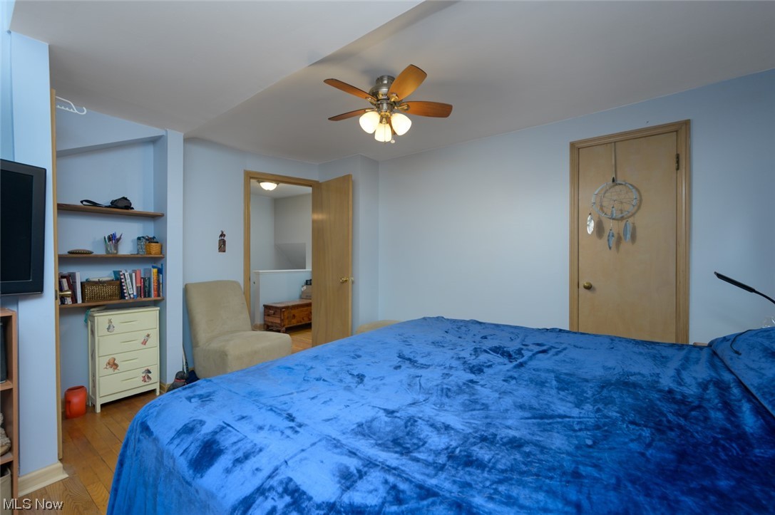 6132 North Canterbury Road Parma, OH 44129 - Photo 25 of 34 Bedroom featuring ceiling fan and hardwood flooring