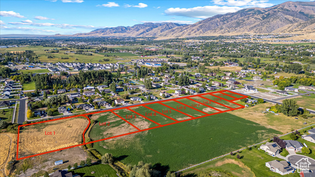 294 West 3400 South, Unit 9 Logan, UT 84321 - Photo 24 of 24 Aerial view of residential area featuring mountains and property parcel outlined