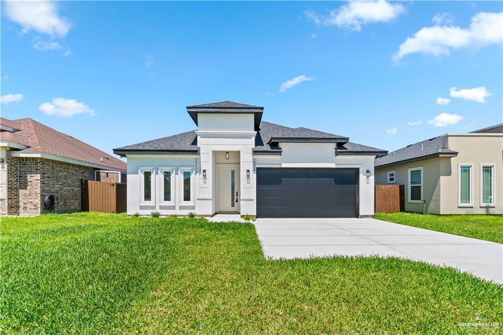 2229 North Ruby Street Edinburg, TX 78541 - Photo 1 of 1 a front view of a house with a yard and trees