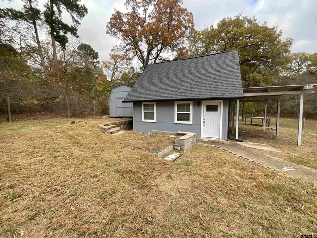 a house with yard in front of it