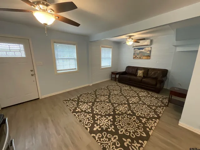 a living room with a couch and a window