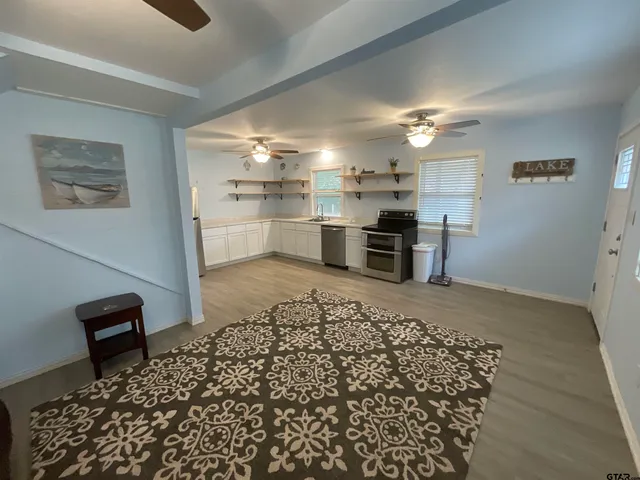 a open kitchen with a table and chairs in it