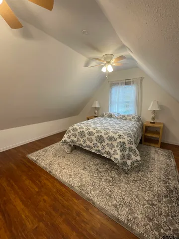 a bedroom with a bed and a cabinets