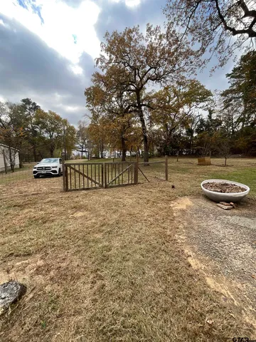 a view of outdoor space with deck and yard