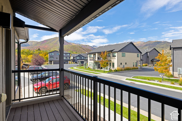 1141 520 West Midway, UT 84049 - Photo 15 of 40 Covered balcony with composite decking and black metal railings