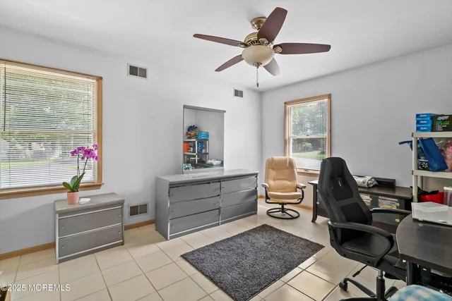 a workspace with furniture and window