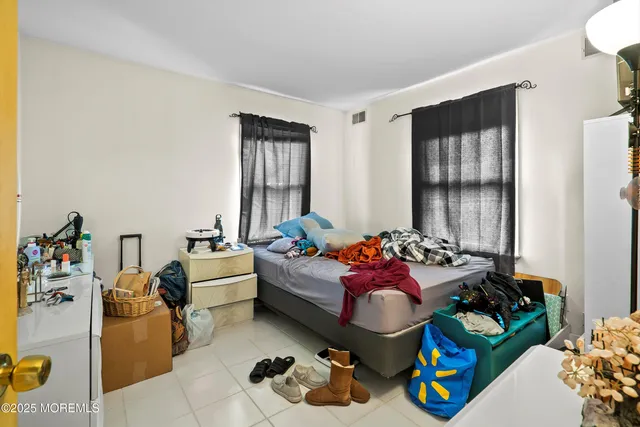 a bedroom with furniture toys and a window