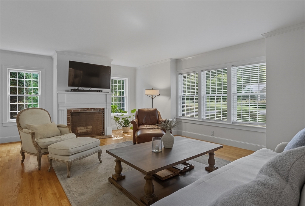 16 Priest Road Berlin, MA 01503 - Photo 15 of 42 a living room with furniture a fireplace and a flat screen tv