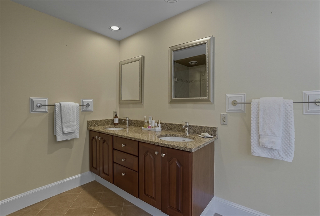 16 Priest Road Berlin, MA 01503 - Photo 25 of 42 a bathroom with a granite countertop sink a mirror and a