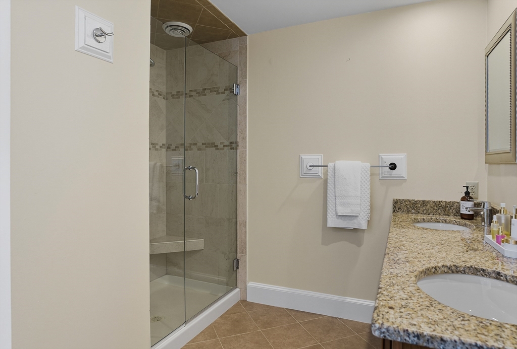 16 Priest Road Berlin, MA 01503 - Photo 26 of 42 a bathroom with a granite countertop shower mirror and vanity