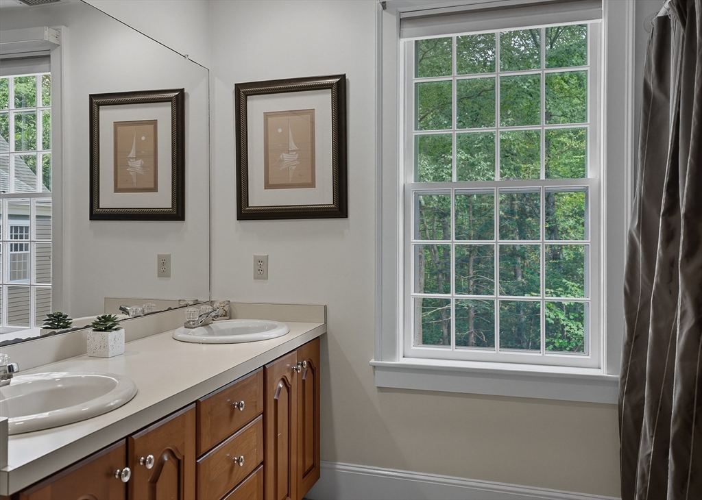 16 Priest Road Berlin, MA 01503 - Photo 29 of 42 a bathroom with a sink and a mirror