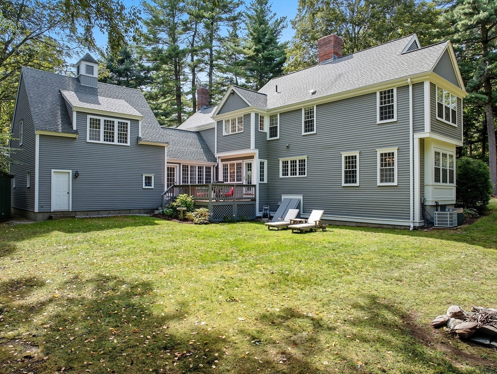 16 Priest Road Berlin, MA 01503 - Photo 36 of 42 a backyard of a house with barbeque oven