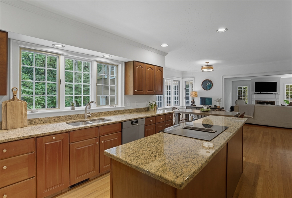 16 Priest Road Berlin, MA 01503 - Photo 9 of 42 a kitchen with a stove sink and cabinets