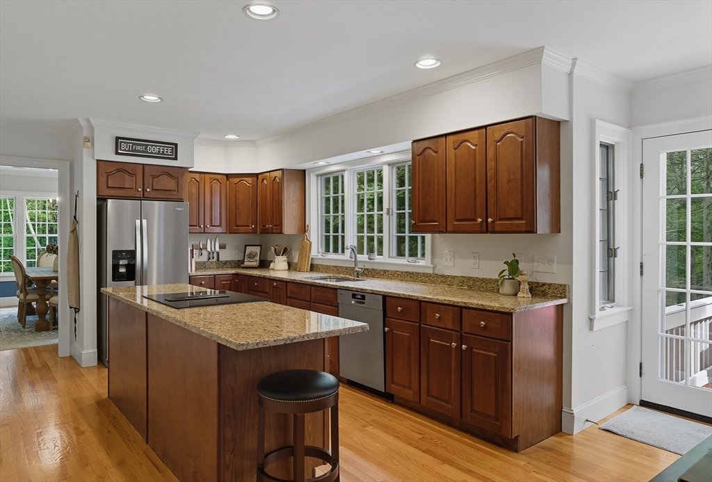 16 Priest Road Berlin, MA 01503 - Photo 10 of 42 a kitchen with stainless steel appliances granite countertop a sink stove and refrigerator