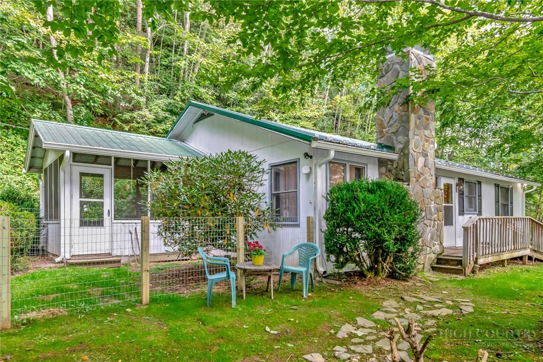 2209-2211 Sugar Mountain 2 Road Newland, NC 28657 - Photo 39 of 50 a view of an house with backyard space and sitting area