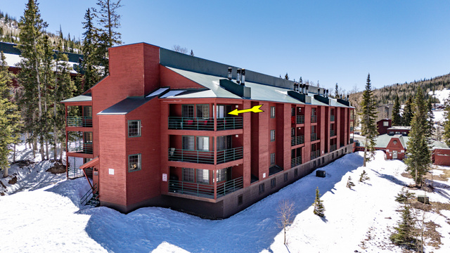407 South Vasels Road, Unit 51 Brian Head, UT 84719 - Photo 35 of 46 Snow covered building featuring a view of apartment building / complex