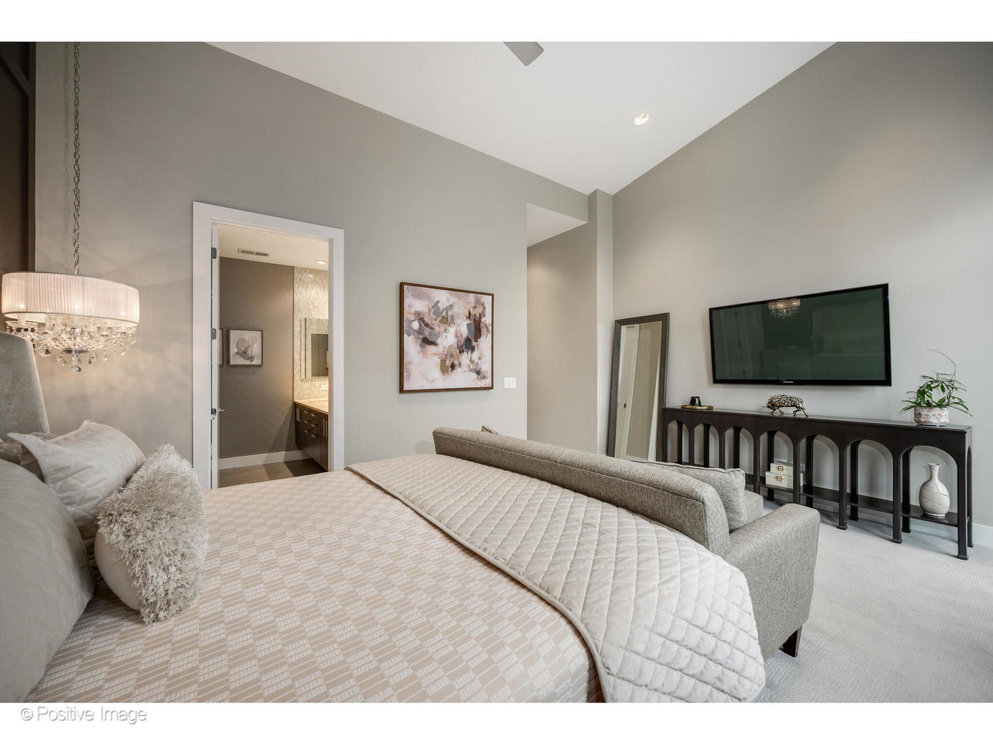 18 North Carpenter Street, Unit PHN Chicago, IL 60607 - Photo 24 of 39 a bedroom with a bed and a flat screen tv