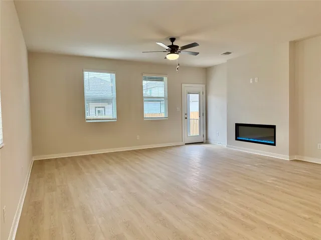 a kitchen with stainless steel appliances a refrigerator and cabinets