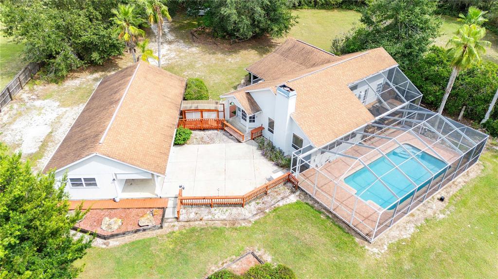 13927 Curley Road Dade City, FL 33525 - Photo 1 of 1 an aerial view of residential house with outdoor space and swimming pool