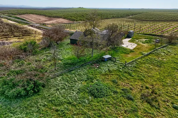 an aerial view of a house with a garden